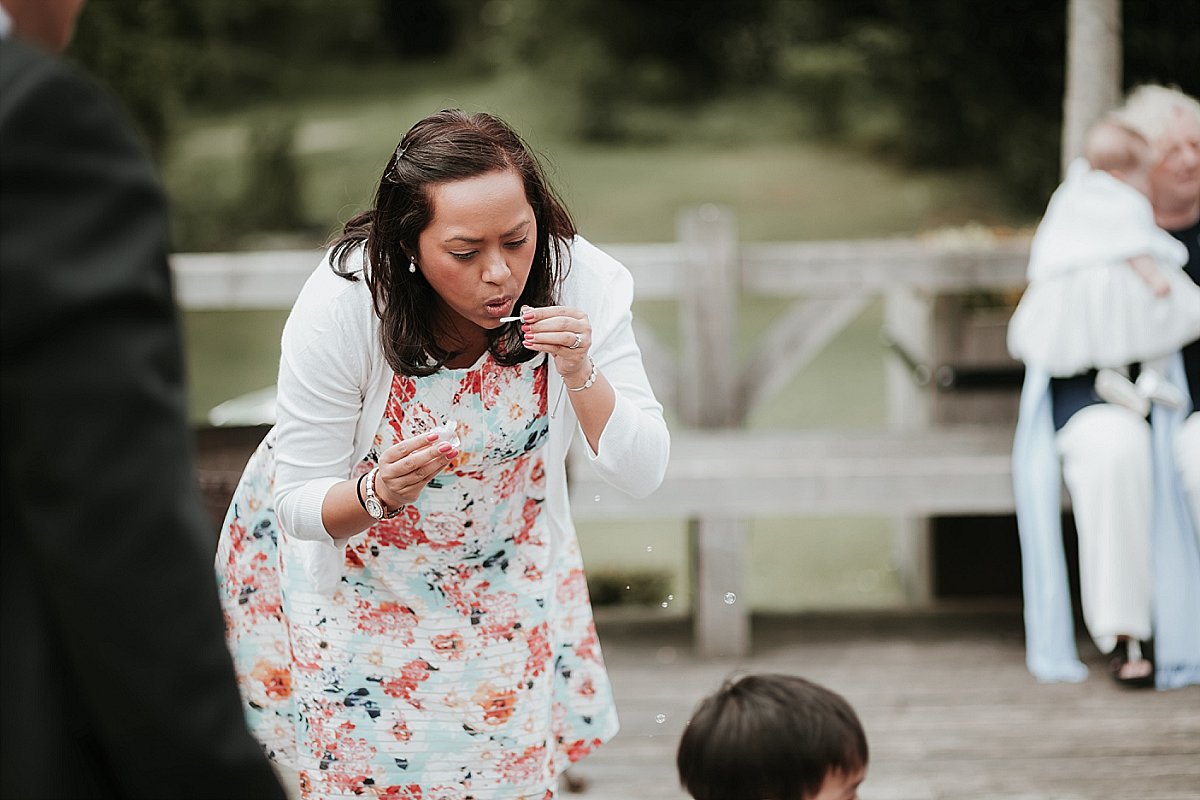 Wedding guests blowing bubbles