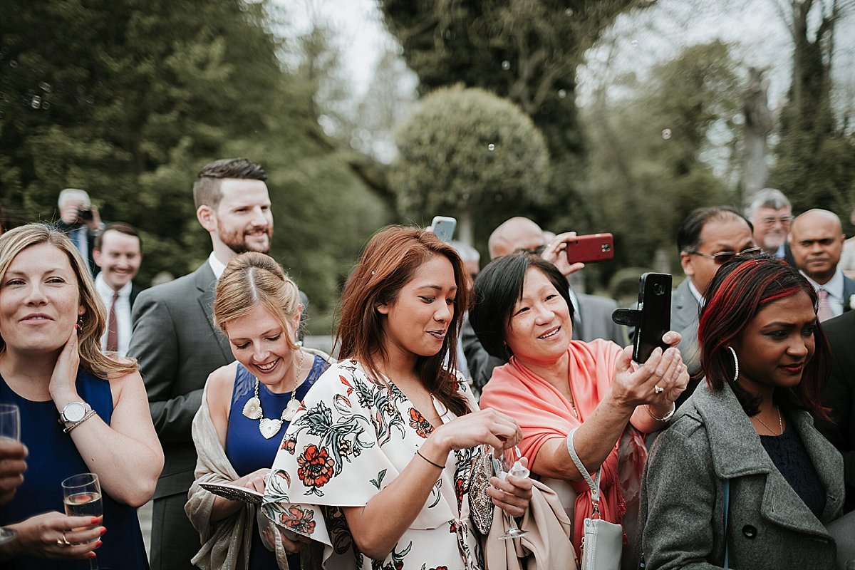 Wedding guest blowing bubbles