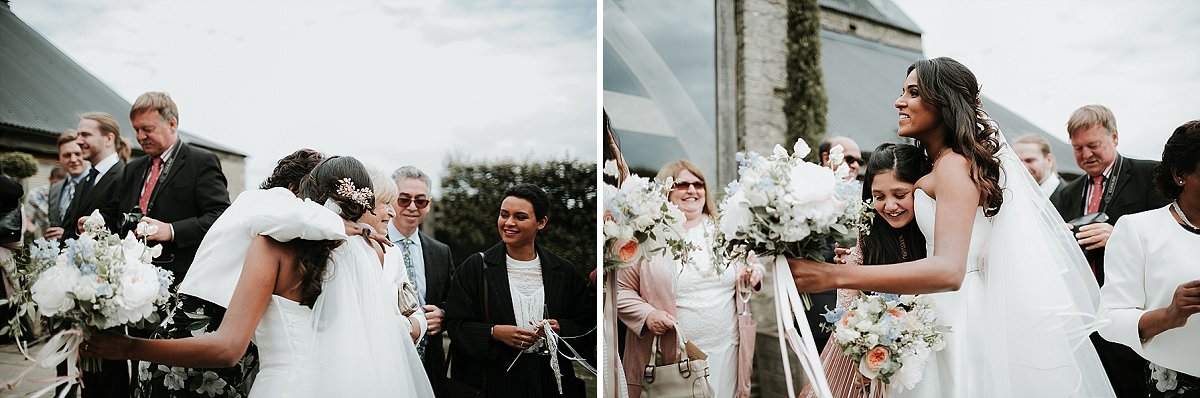 bride hugging bridesmaid