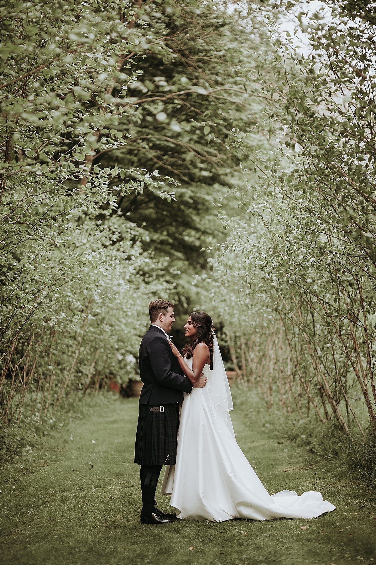 Bride and groom posing for portraits