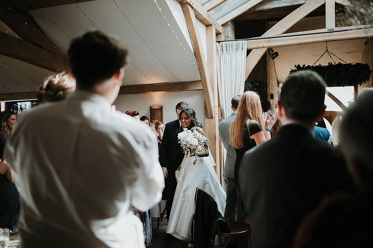 Bride walking in to applause