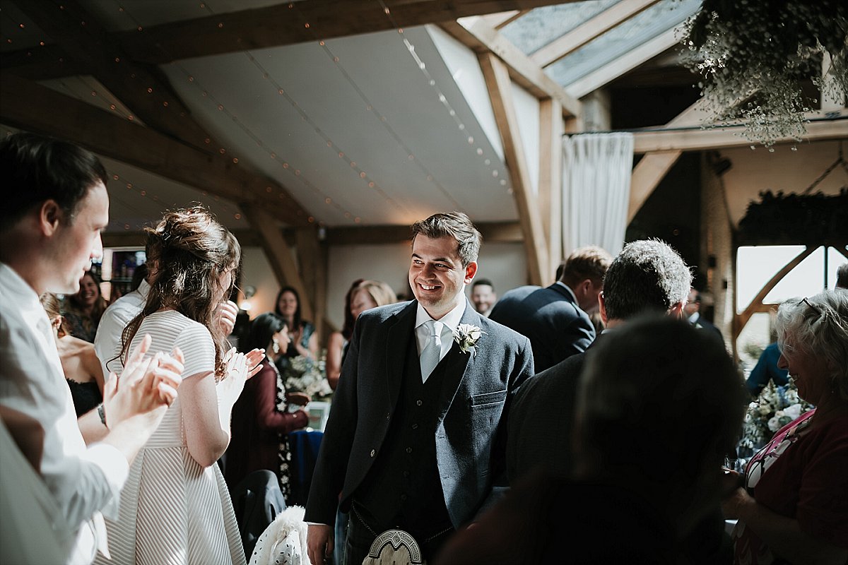 Groom smiling