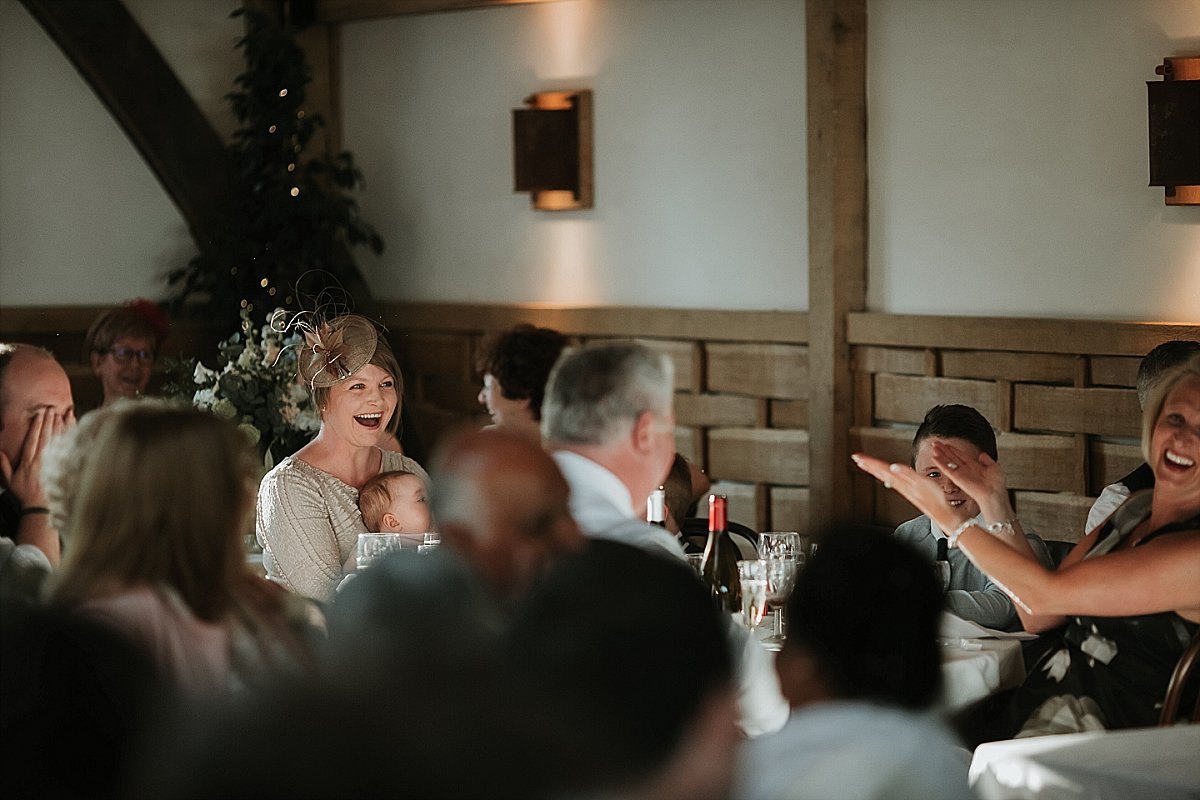 Wedding guest laughing at speech