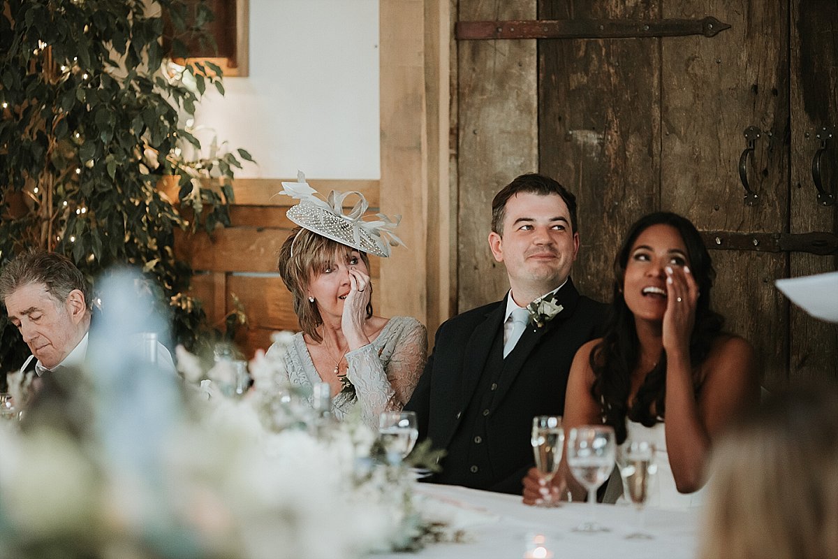 Bride wiping tear away