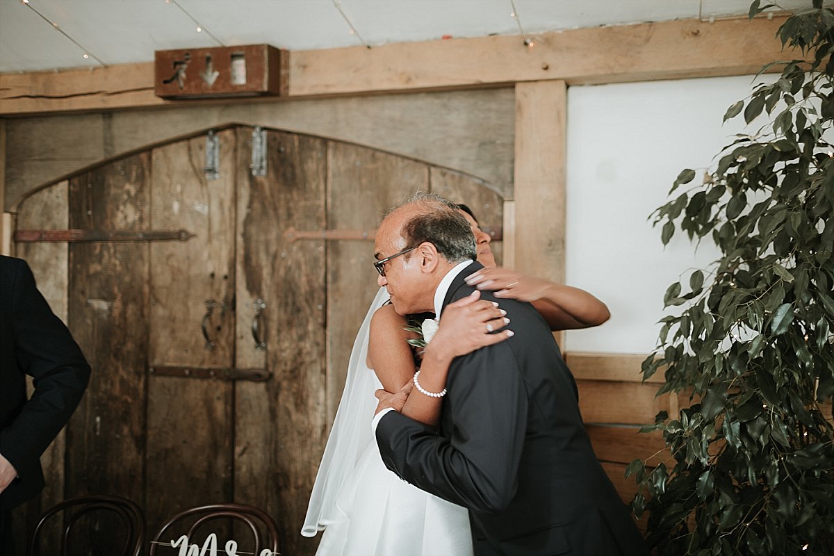 Bride hugging her father after his speech