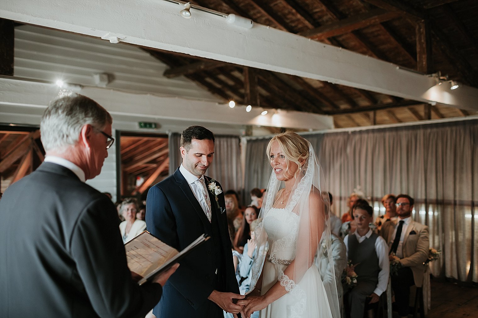 Bride and Groom holding hands during their wedding at The Lobster Shack