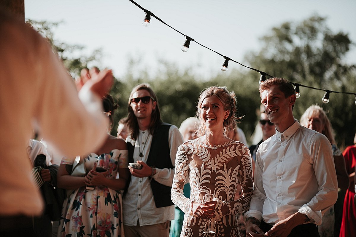 Bride and Groom laughing during the father of the brides speech