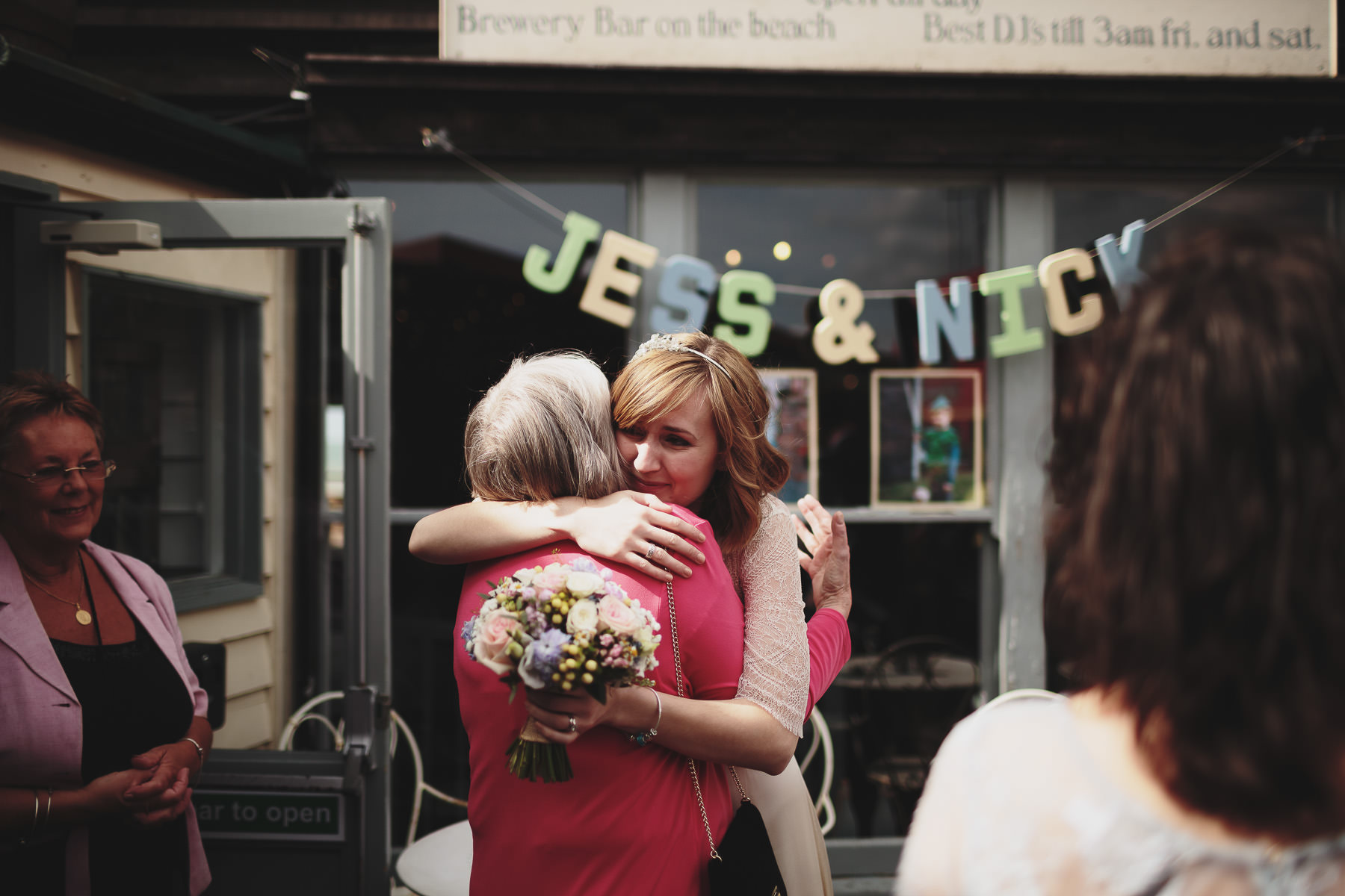 bride hugging her wedding guest