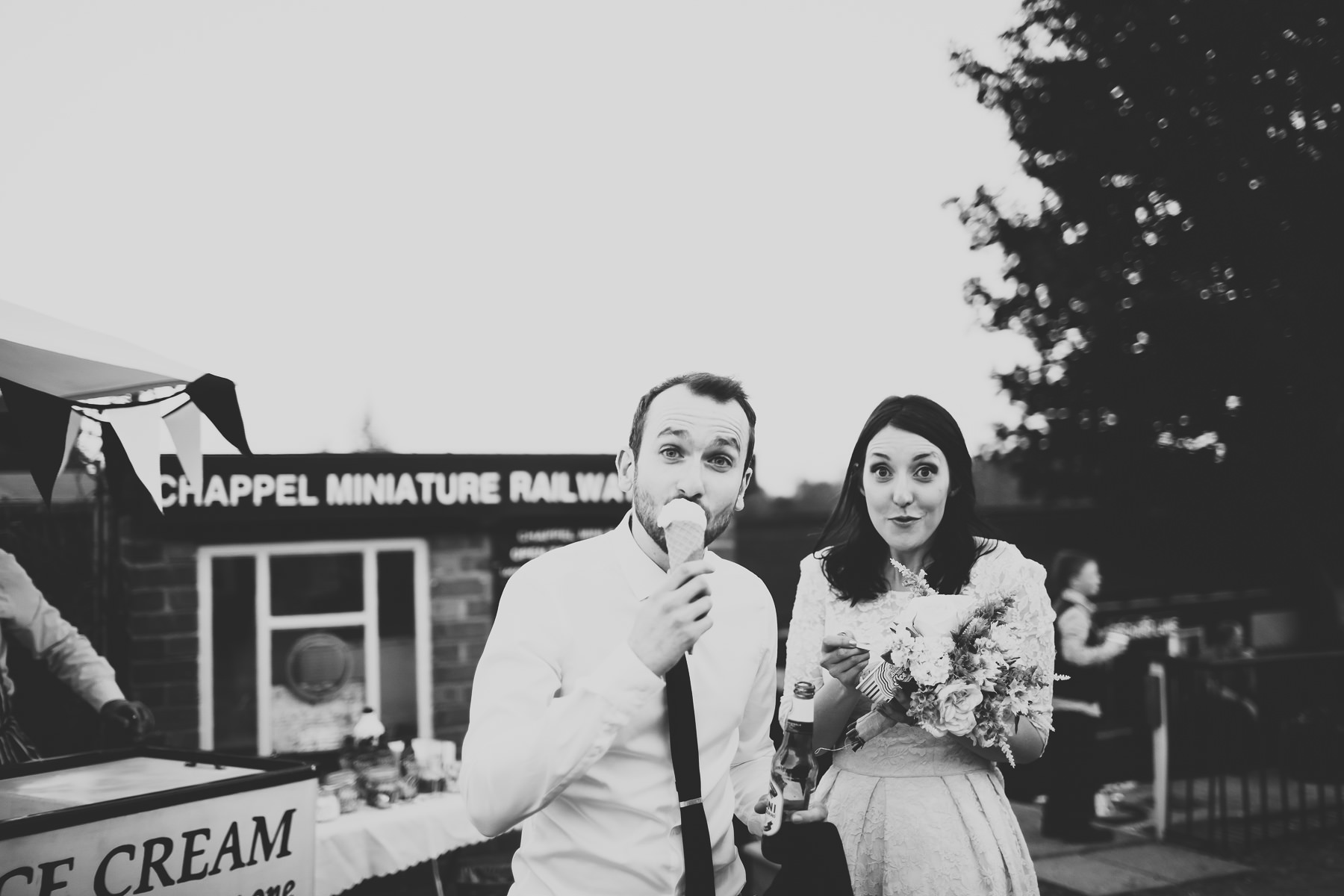 bride and groom enjoying an ice cream
