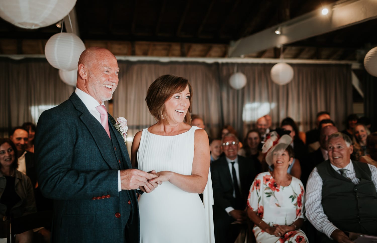 Bride and Groom laughing during their wedding ceremony