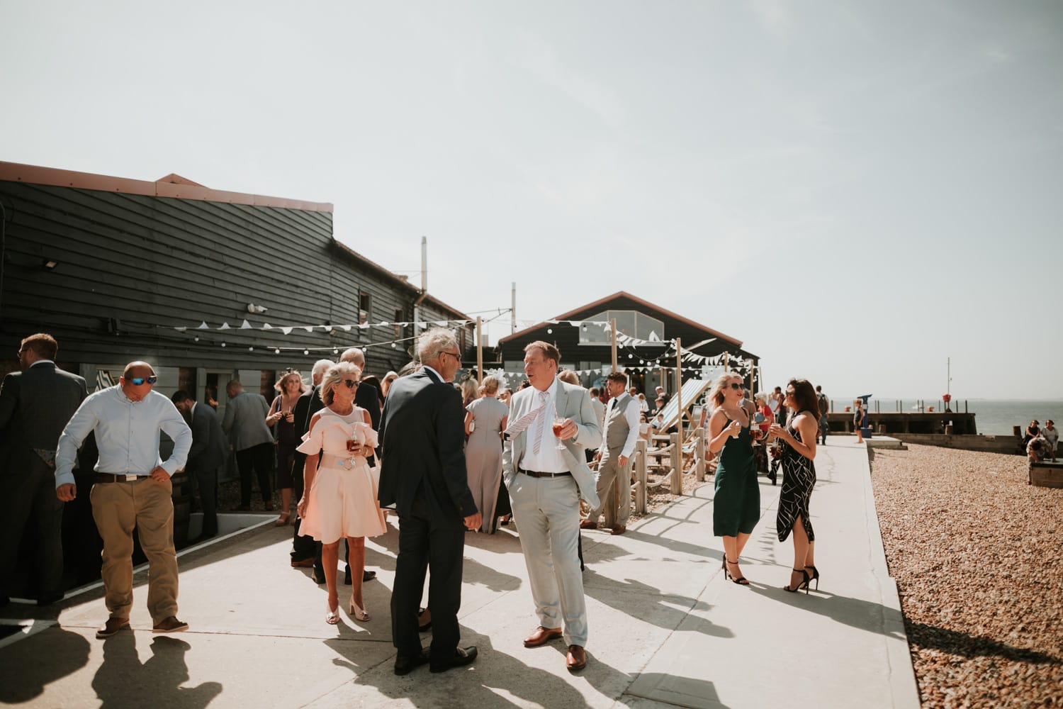 Wedding guests chatting at East Quay