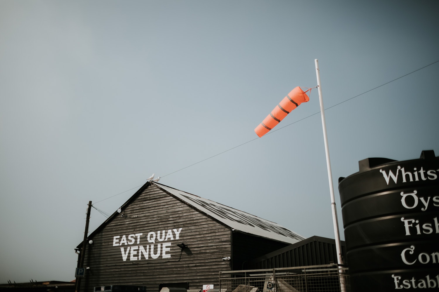 Photo of East Quay Venue against a bright blue sky