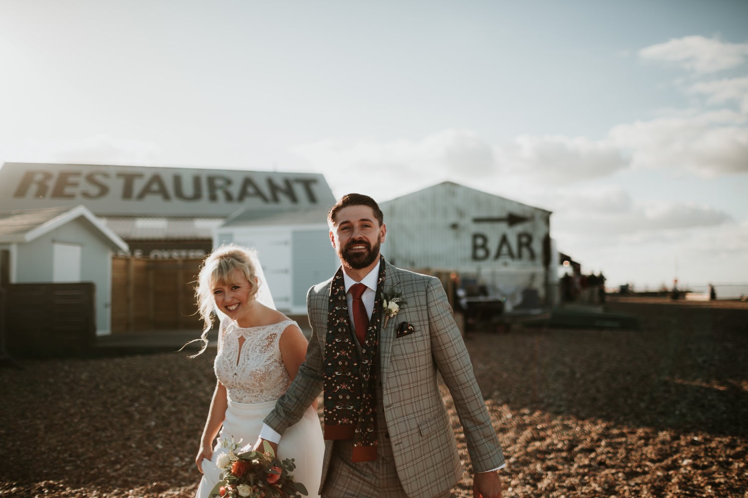 Bride and Groom walking together and smiling