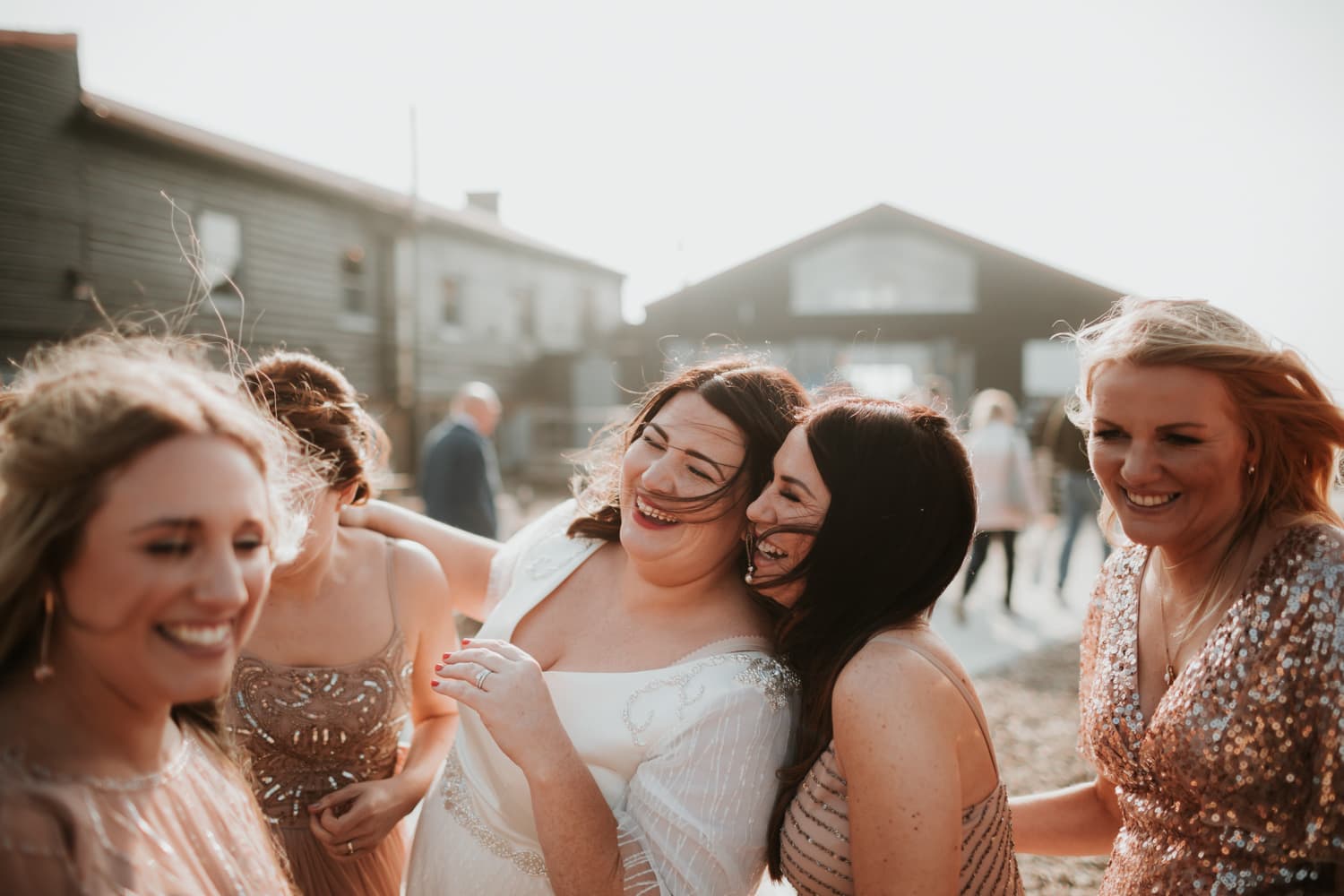 Bride laughing with her bridesmaid