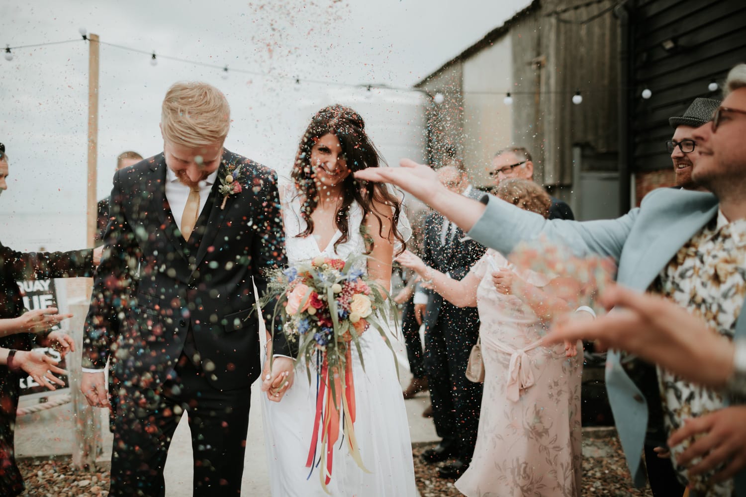 Couple having confetti thrown at them