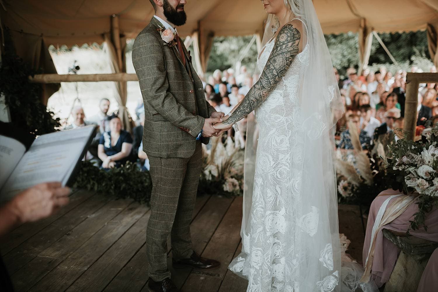 Bride and Groom getting married in the Woodsmans Hut at Wilderness Weddings in Kent