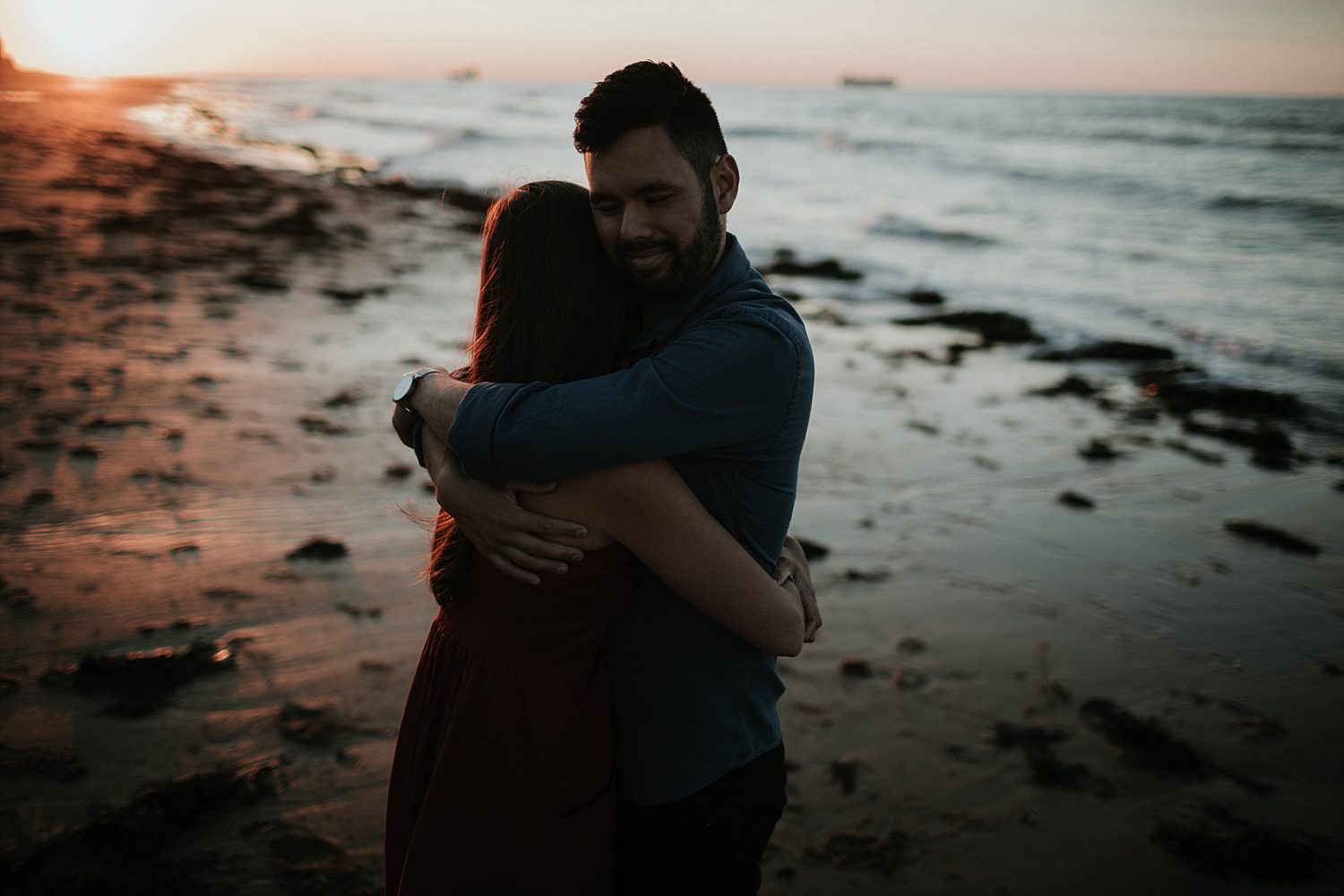 Couple hugging on Whitstable beach