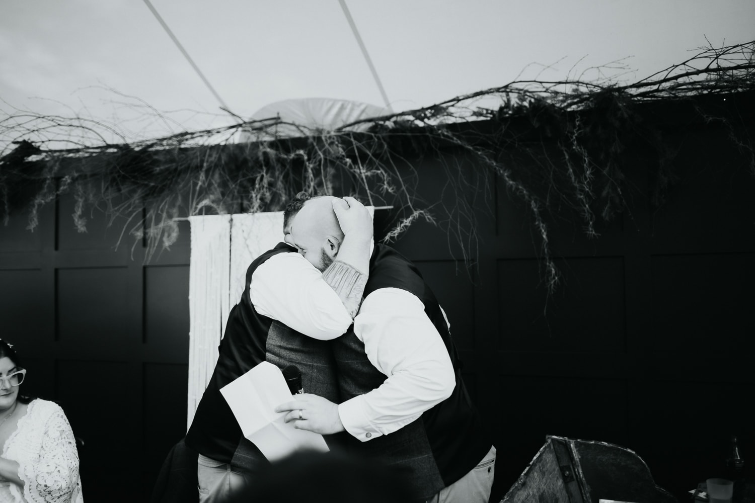 Groom hugging his best man after his wedding speech
