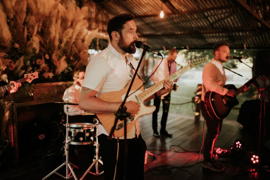 Singer in a band playing guitar