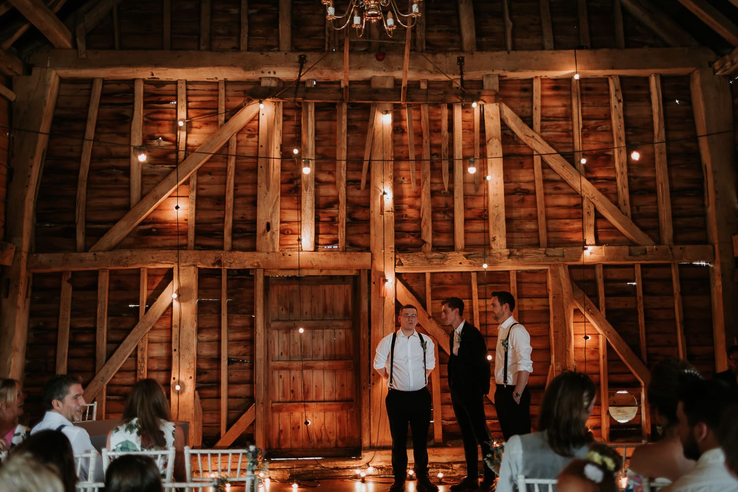 Groom waiting at the front of the room