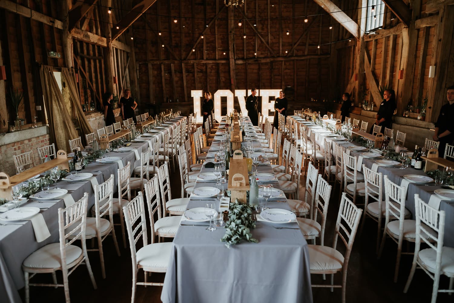 The interior of The Great Barn in Rolvenden set up for a wedding breakfast