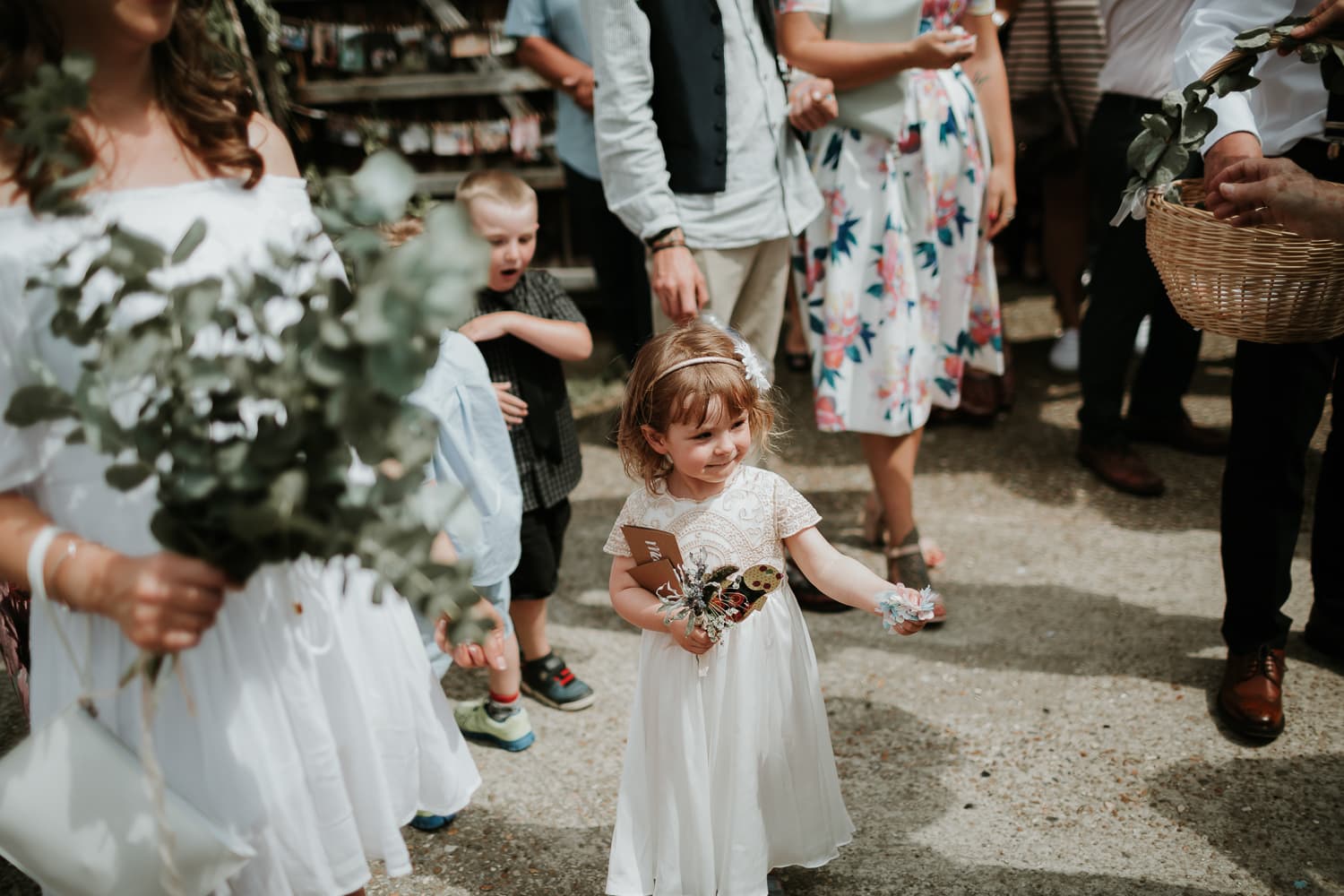 flower girl holding confetti